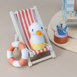 seagull-on-a-chair-and-innertube-with-fish-in-a-pail