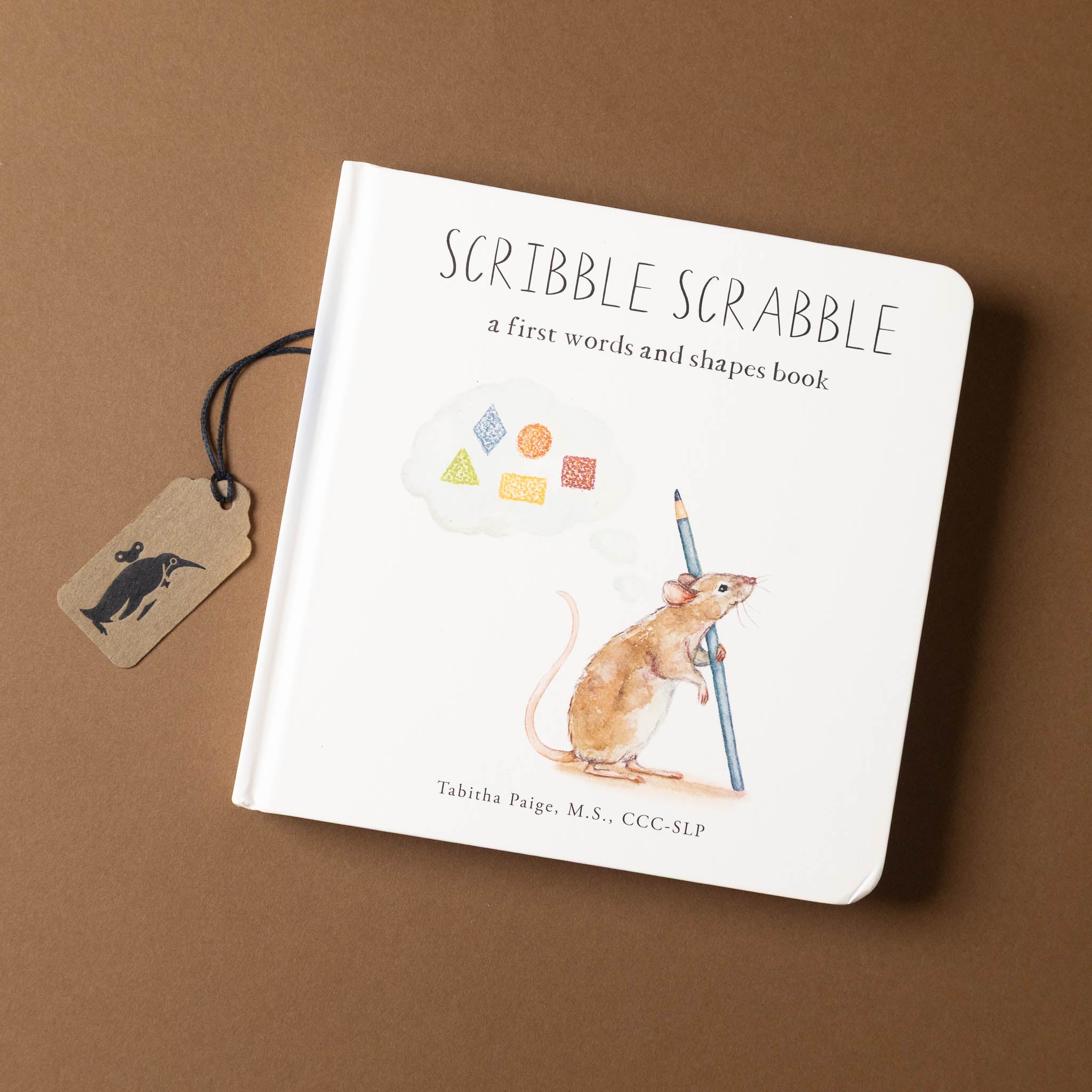 Children's book titled 'Scribble Scrabble' on a brown background