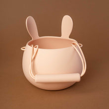 Load image into Gallery viewer, blush colored silicone bucket in bunny shape, detail of the back with the handle
