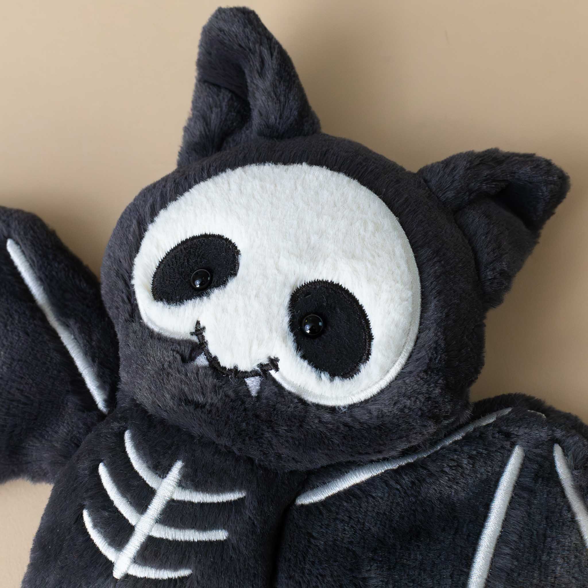 skelebat-jim-black-and-white-bat-with-bones-embroidered-stuffed-animal-face