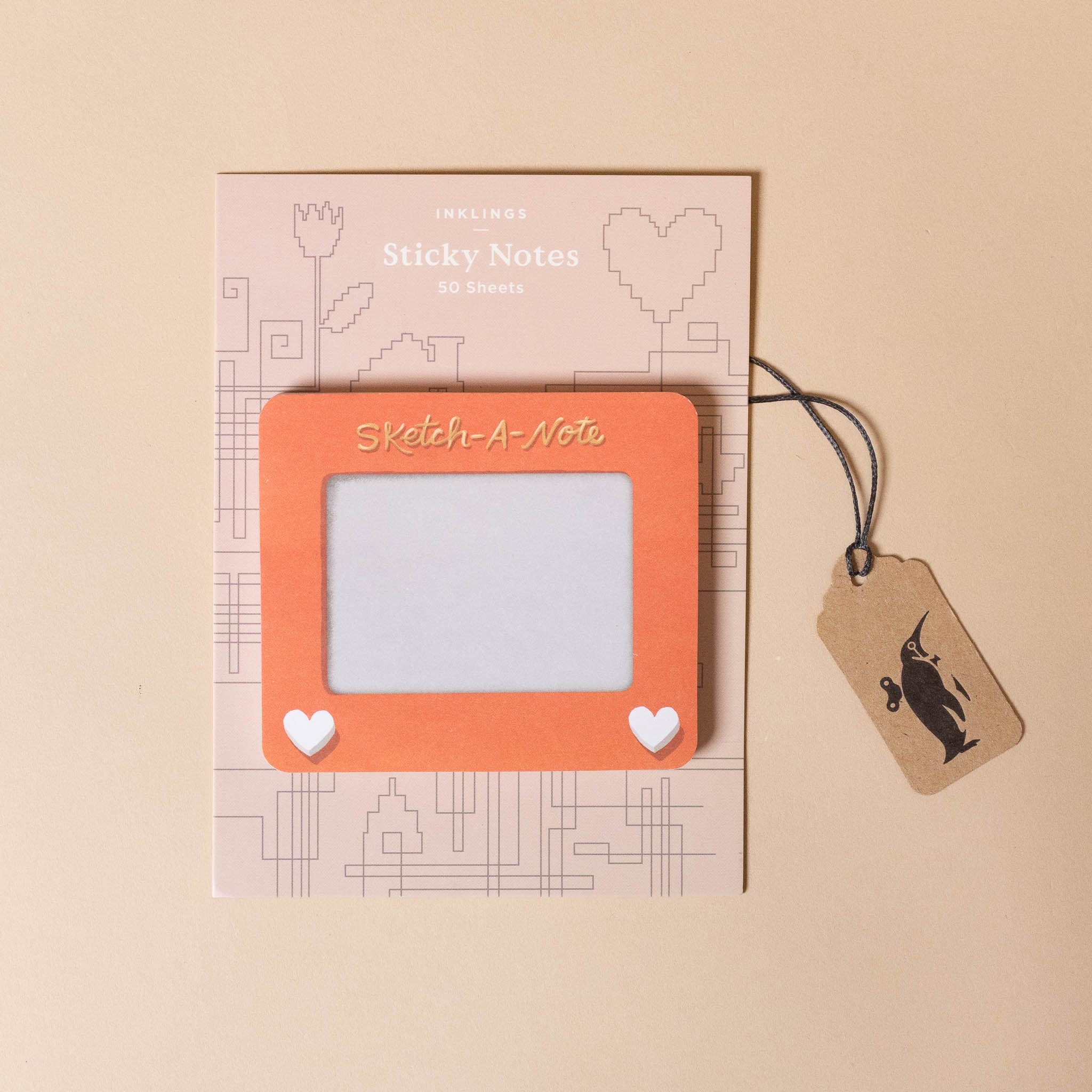 Sketch-a-Note with a clear window and heart designs on a beige background