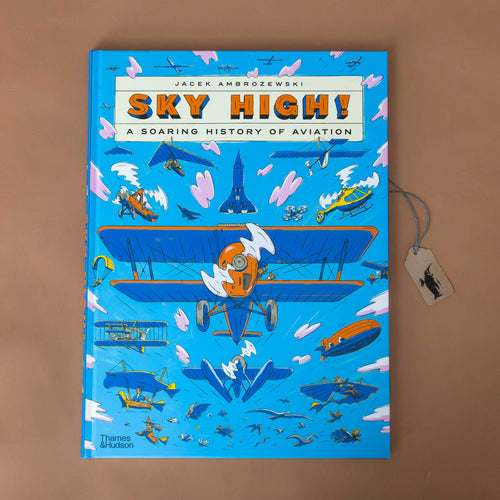  Analyzing image    sky-high-a-soaring-history-of-aviation-blue-book-cover-with-many-different-planes-blimps-and-other-aviation-vehicles