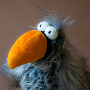 slow-flyer-bird-close-up-of-big-eyes-and-large-orange-beak