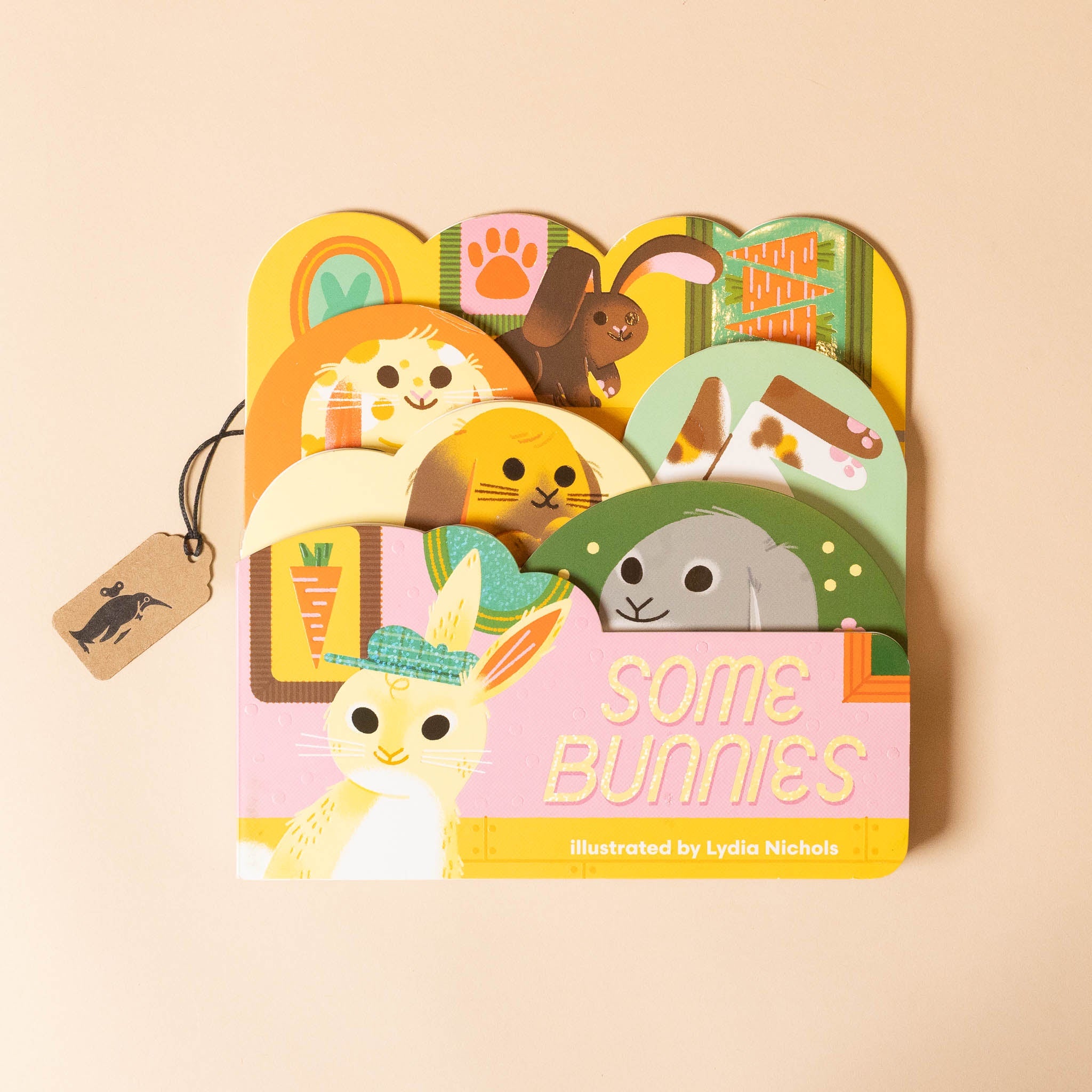 Children's  some-bunnies-board-booktitled 'Some Bunnies' with colorful illustrations on a beige background
