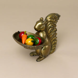 squirrel-brass-dish-stand-holding-colorful-tops
