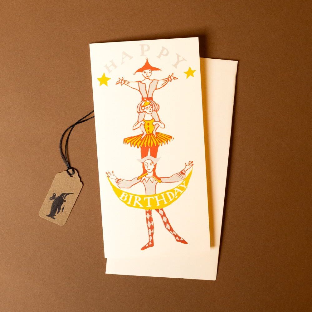 stackable-birthday-greeting-card with acrobats and 'Happy Birthday' text on a brown background