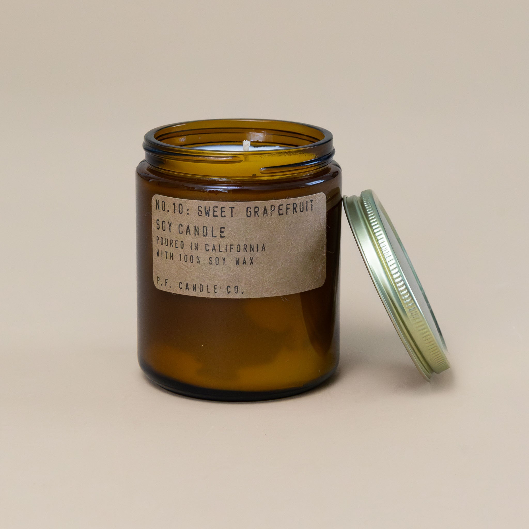 sweet-grapefruit-candle-with-amber-apothecary-glass-container-and-brass-lid