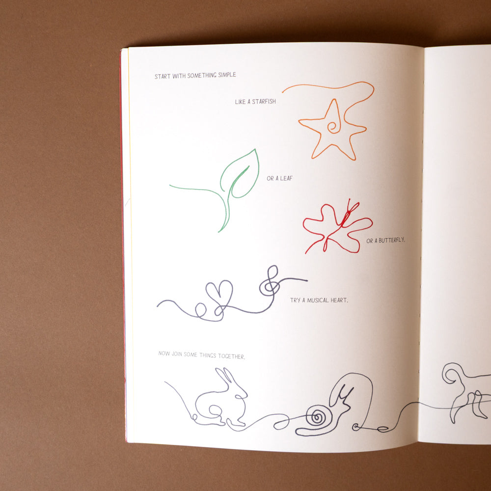 take-a-line-for-a-walk- Open book with line art illustrations on a brown background