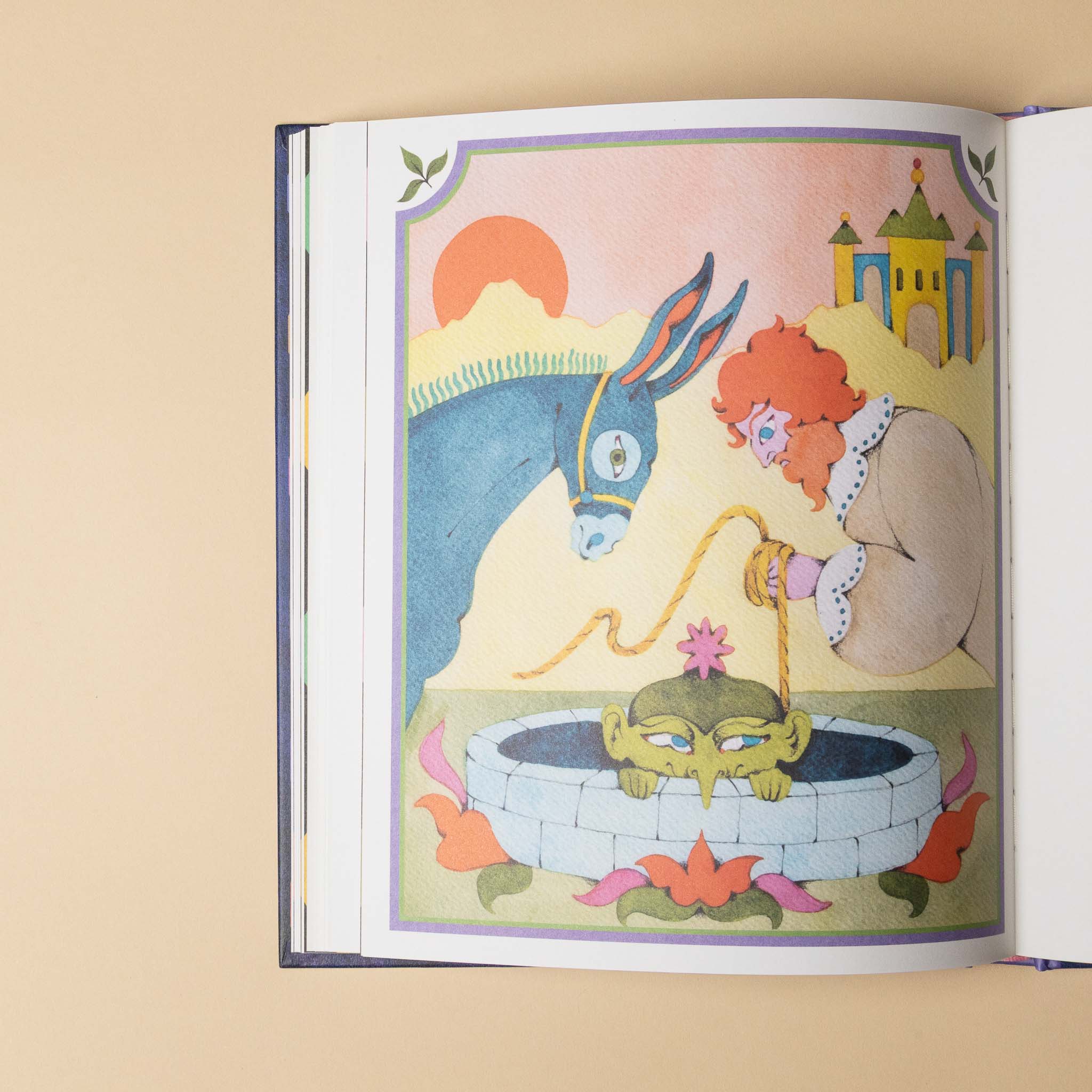 Illustrated tales-of-the-fae-enchanting-stories-of-fairies-elves-and-sprites open to a page with a donkey and a man at a fountain with a troll.