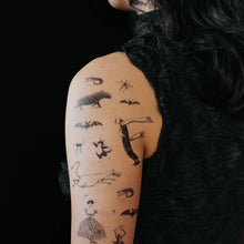 Load image into Gallery viewer, goreys-creatures-and-figures-temporary-tattoo-sheet-on-model&#39;s-arm