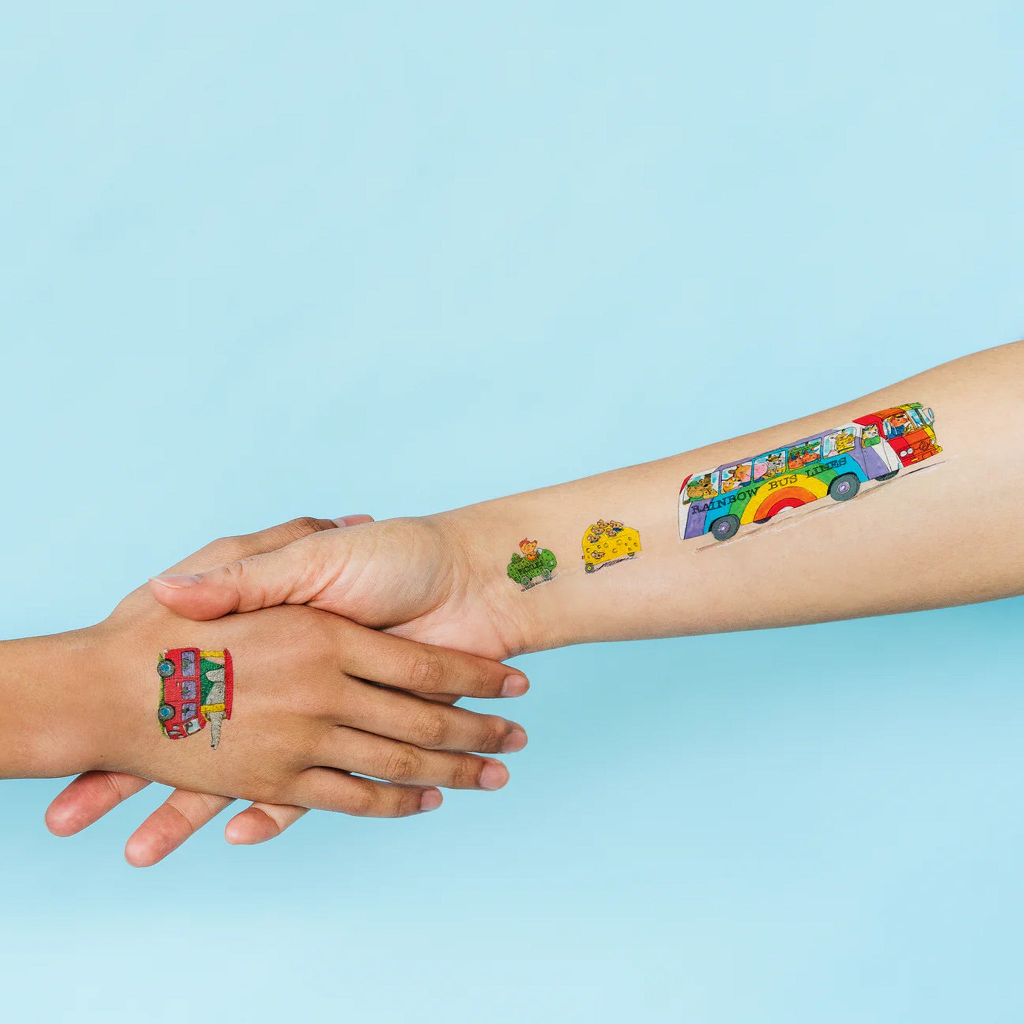 things-that-go-temporary-tattoo-sheet-with-a-variety-of-vehicles-with-pickles-cheese-bananas-hot-dog-on-models-arm