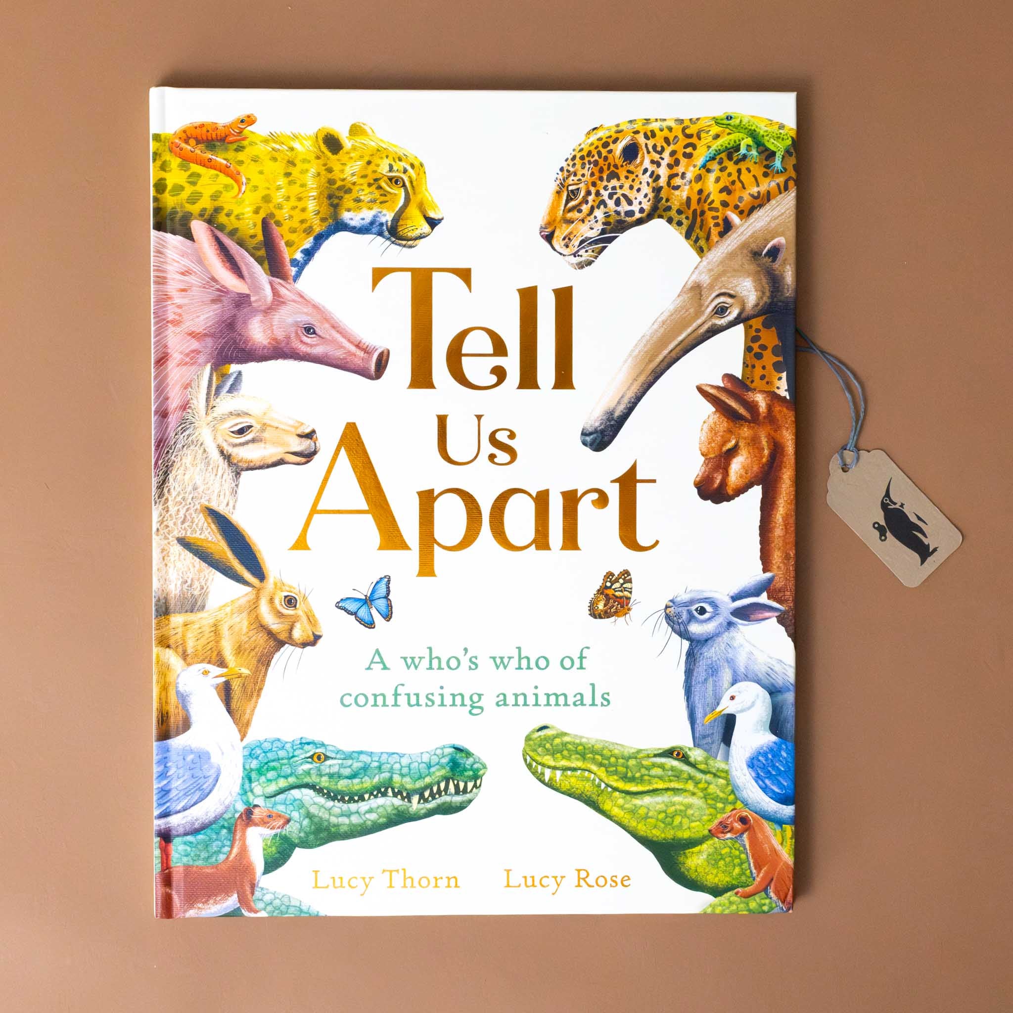 tell-us-apart-a-whos-who-of-confusing-animals-book-cover-with-similar-animals-such-as-aardvark-and-anteater-on-opposing-sides