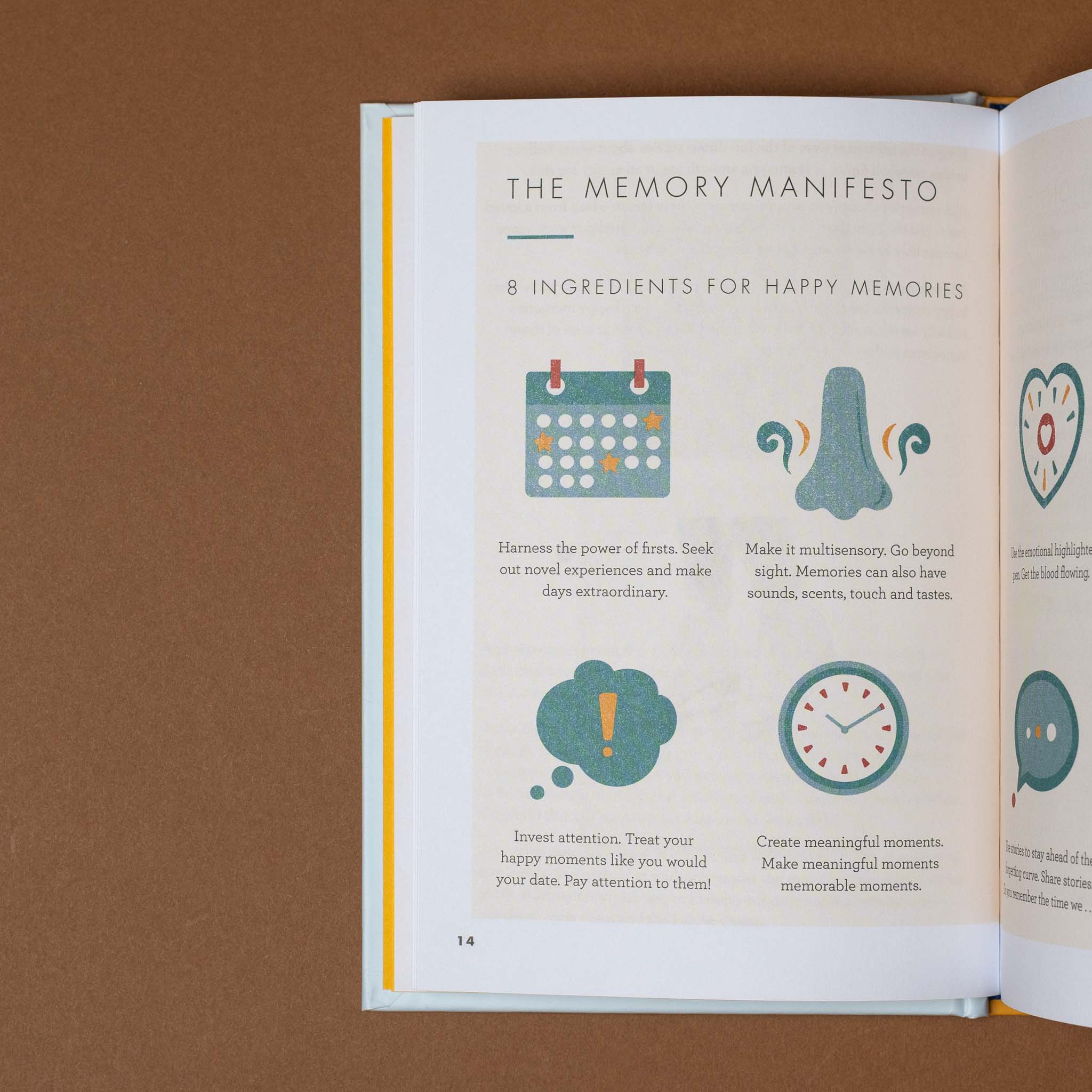 the-art-of-making-memories Open book titled 'The Memory Manifesto' with illustrations on a brown background