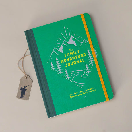 the-family-adventure-journal-green-cover-with-a-path-through-mountains-and-trees-on-the-cover