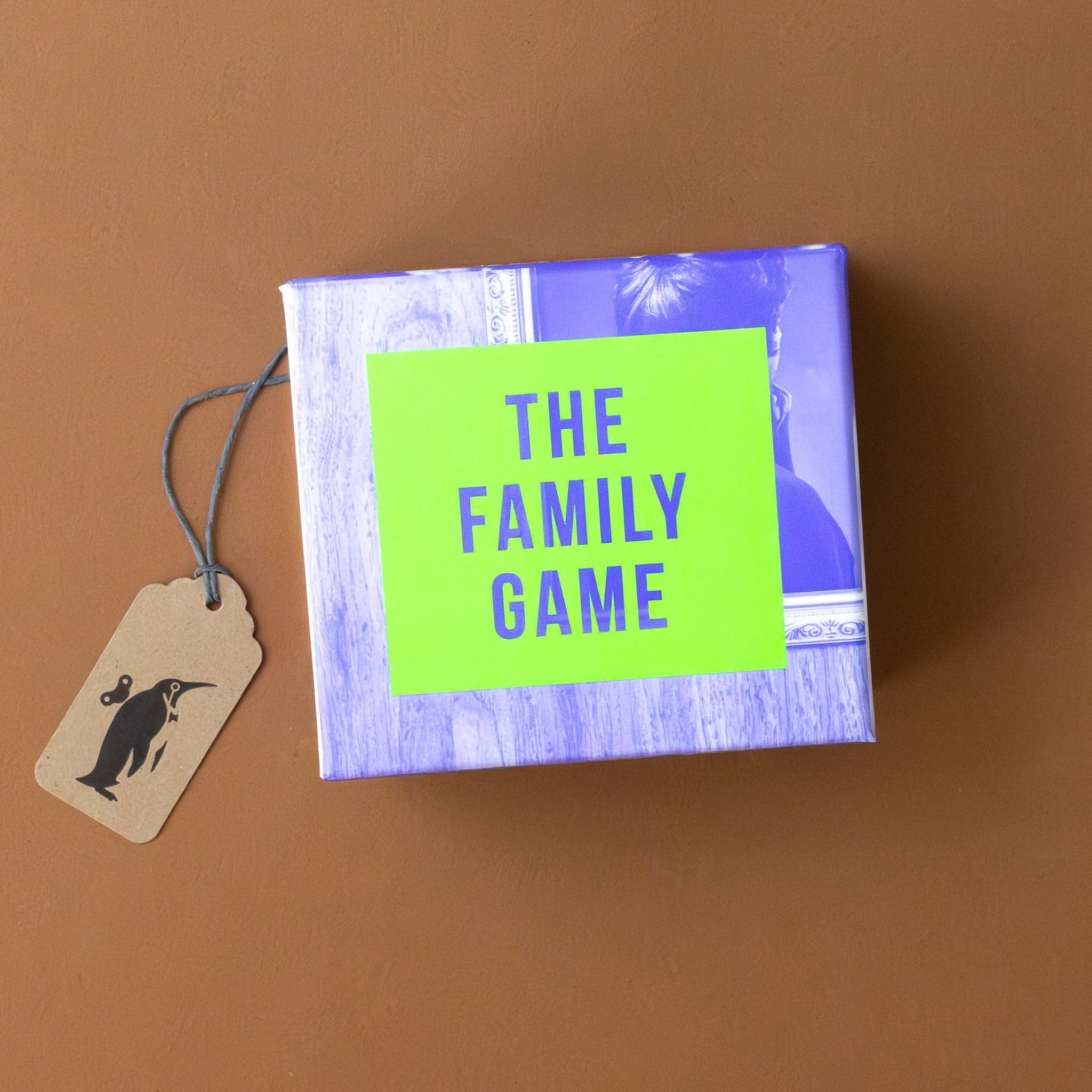 the-family-game-box-with-green-rectangle-with-blue-text-and-background