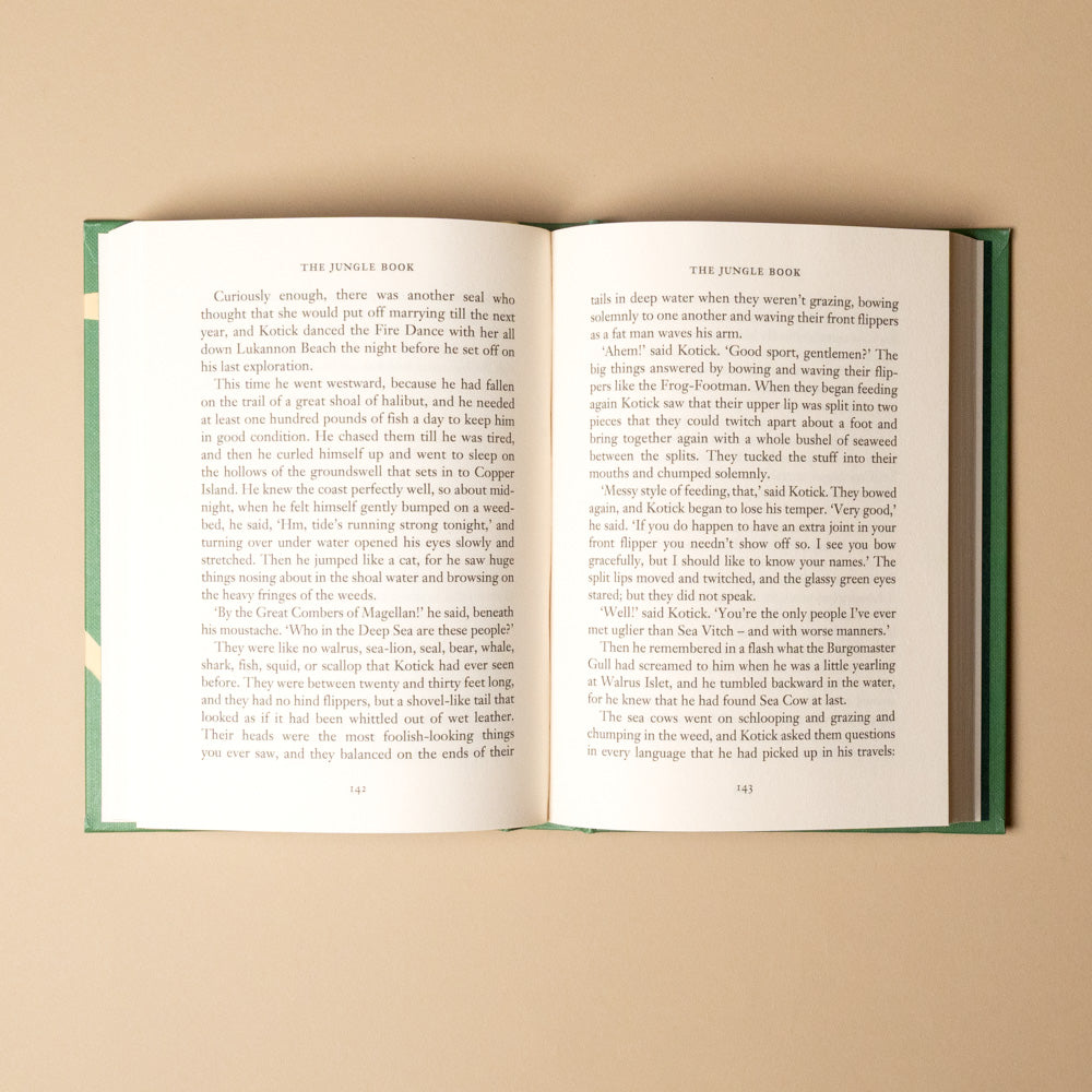 the-jungle-book Open book with text on a beige background