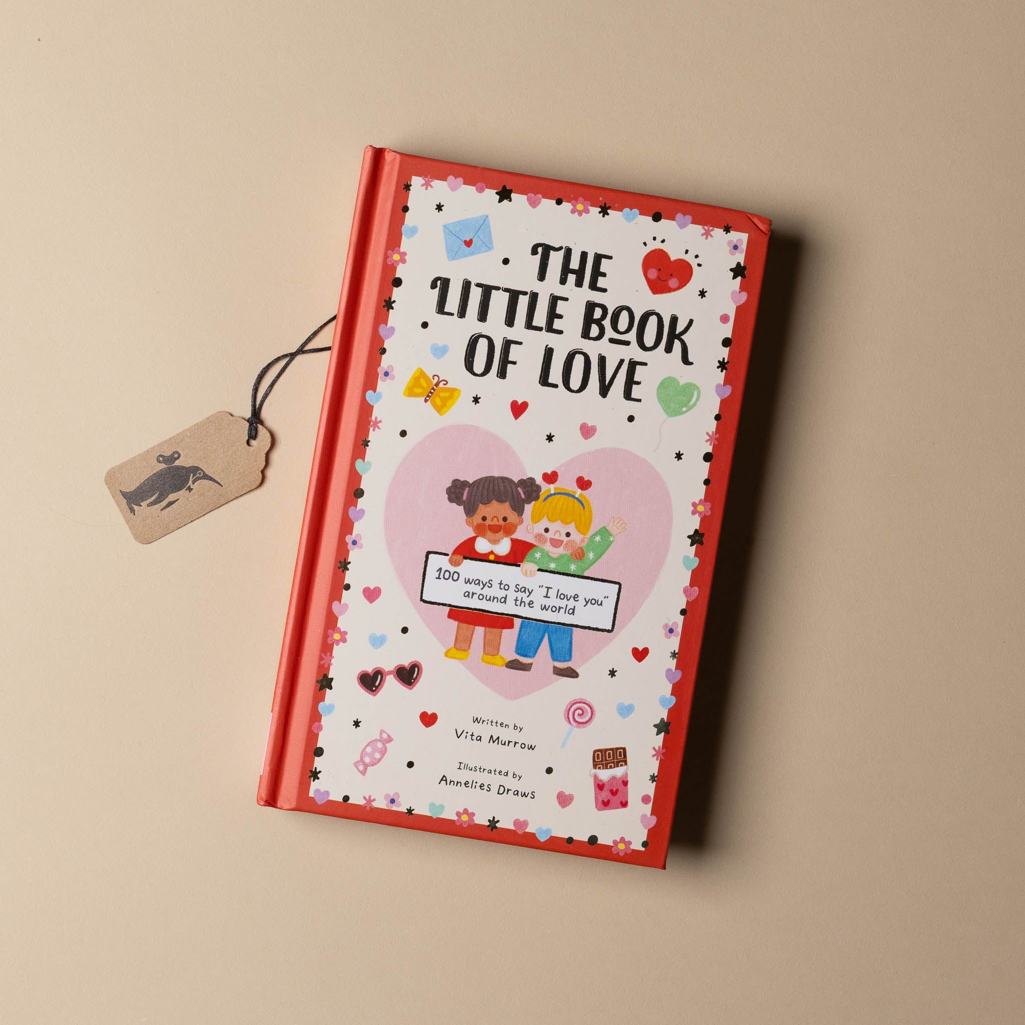 Book titled 'The Little Book of Love' on a beige background
