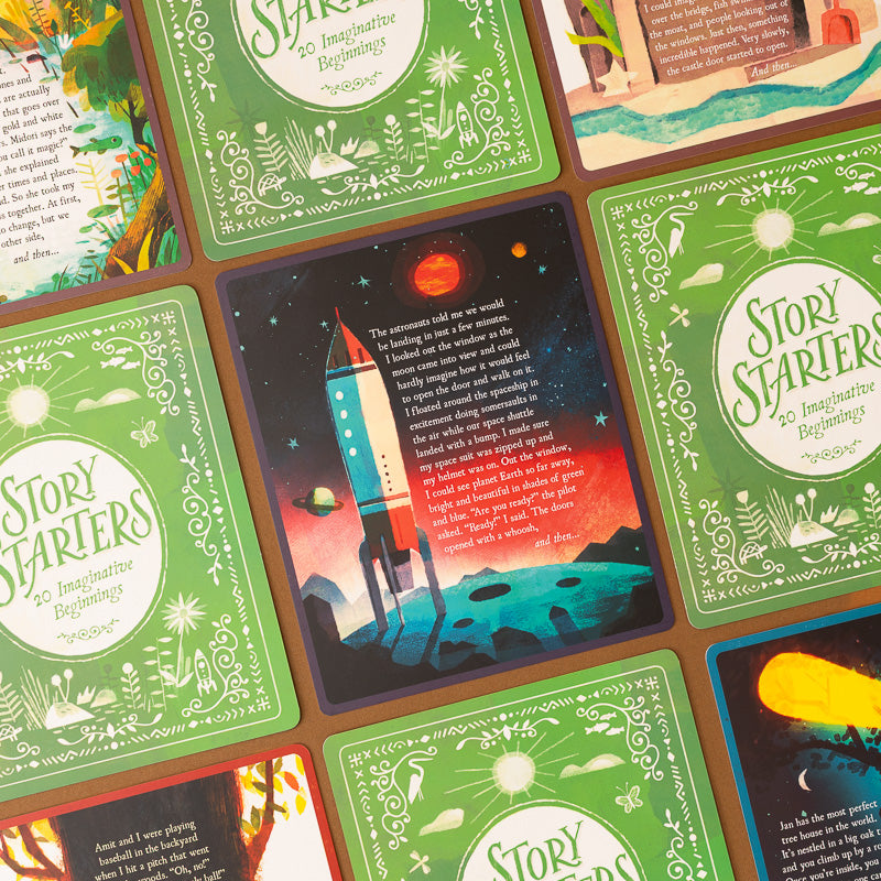 A close-up of illustrated cards arranged in a grid, with one central card showing a rocket launching into space and surrounding cards featuring green borders and decorative text.