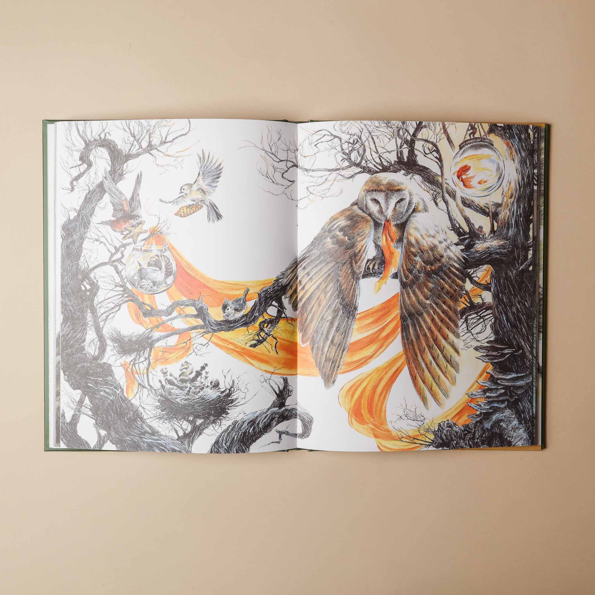 Open the-storytellers-almanac with detailed illustrations of birds and trees on a beige background