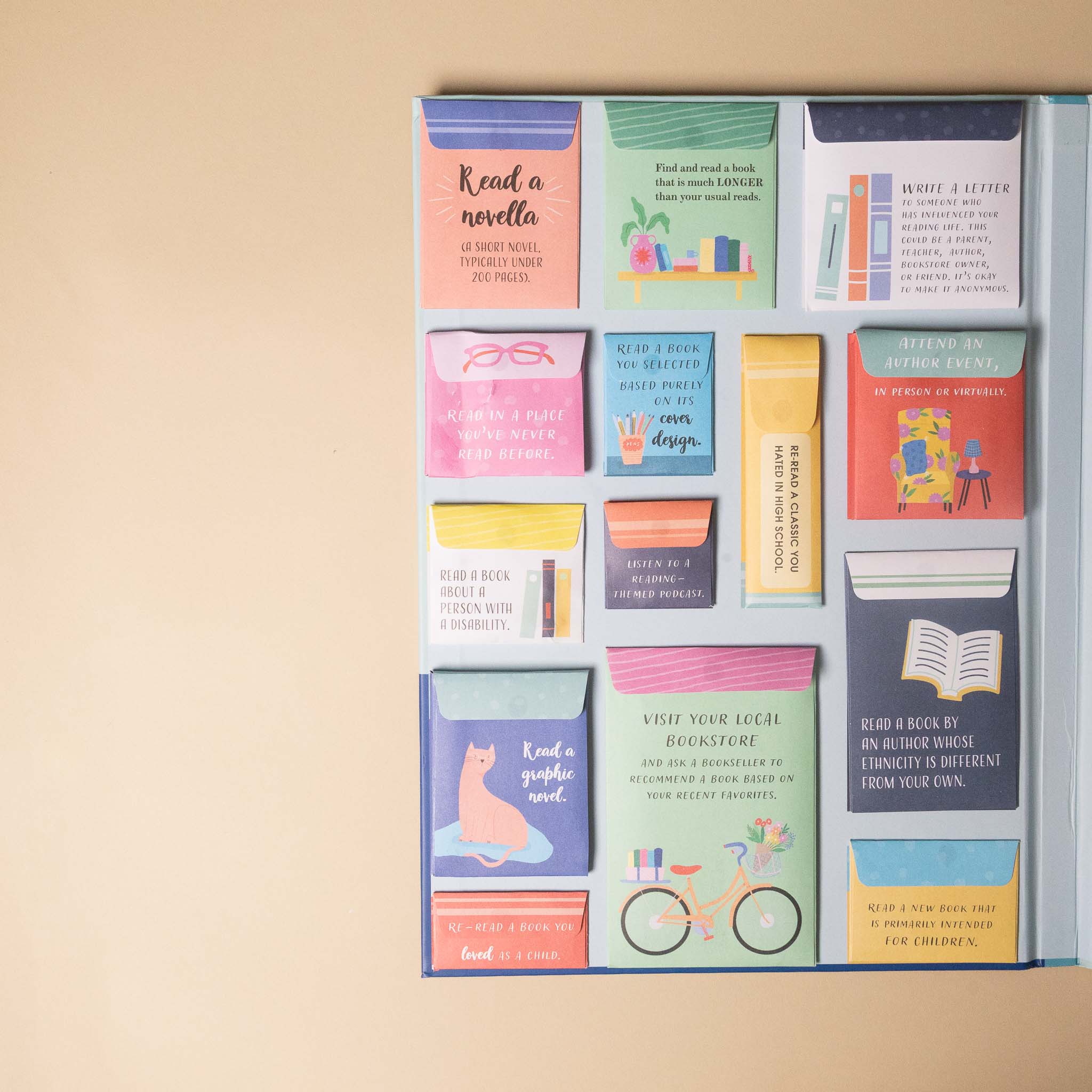 the-ultimate-reading-challenge-book Set of colorful book-themed pockets with notes on a beige background