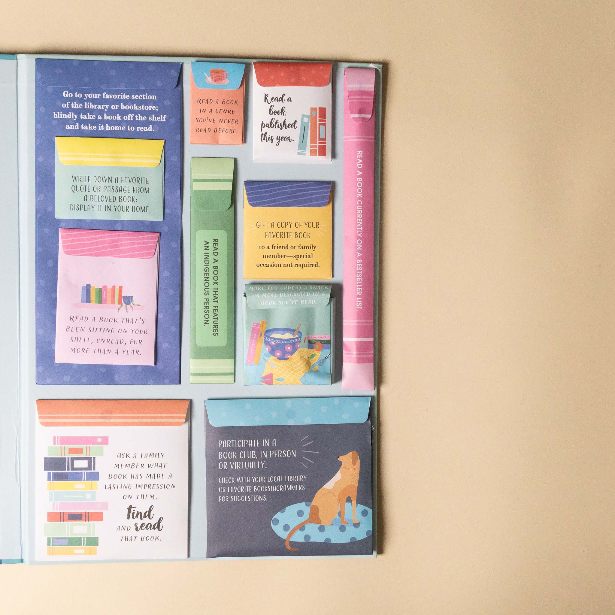 the-ultimate-reading-challenge-book Set of colorful book-themed pockets with notes on a beige background