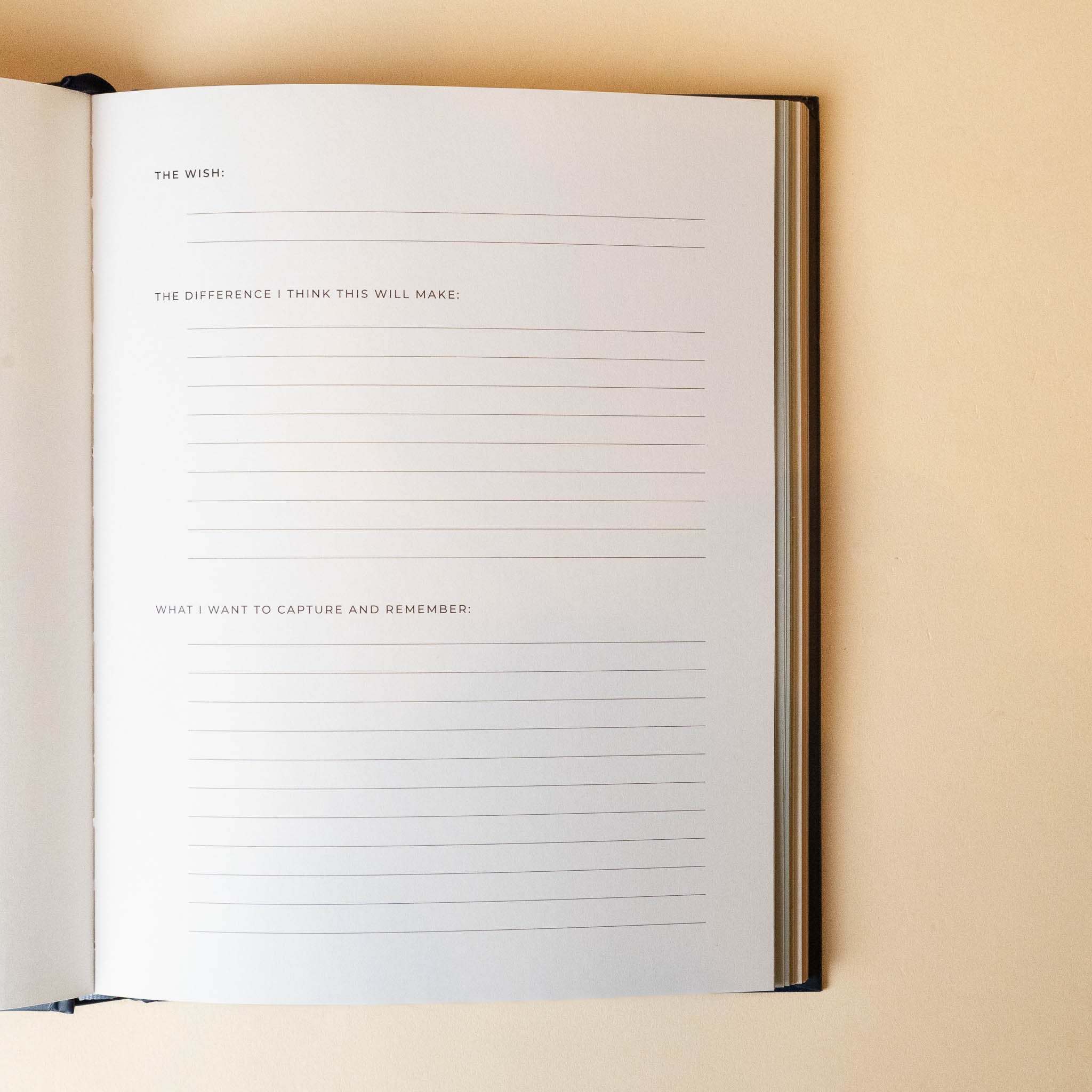 Open the-wish-list-book with lined pages on a beige background