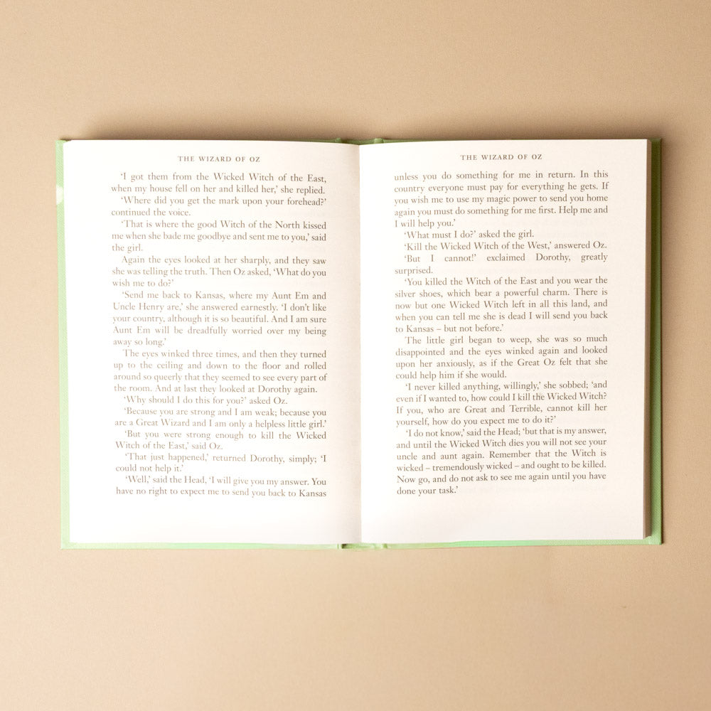 the-wizard-of-oz Open book with text on a beige background
