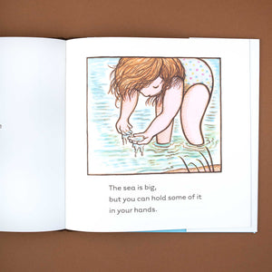 Little girl in the sea from The World and Everything In It Book by Kevin Henkes