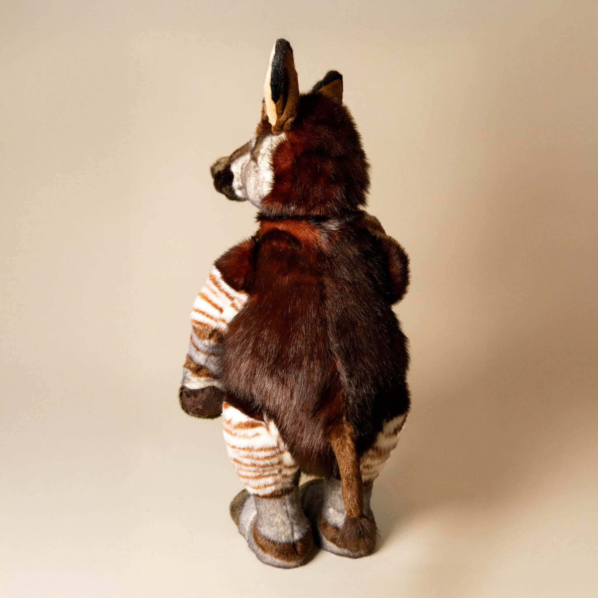 trailblazer-the-traveling-okapi-standing-stuffed-animal-back