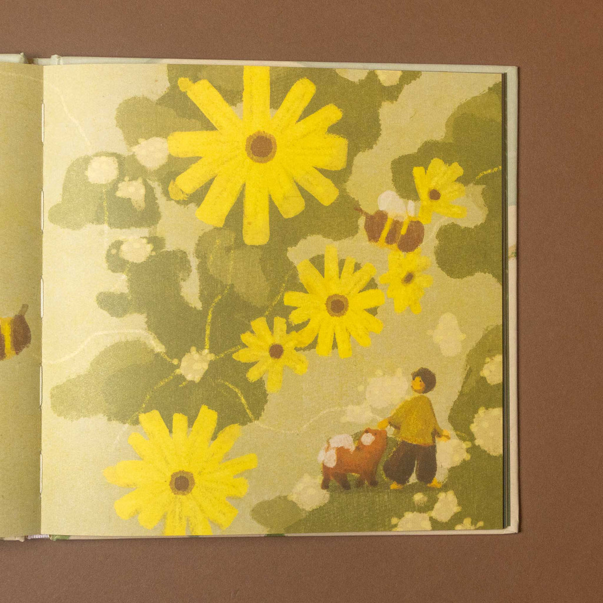 treasures-everywhere-book open page with yellow flowers child and dog