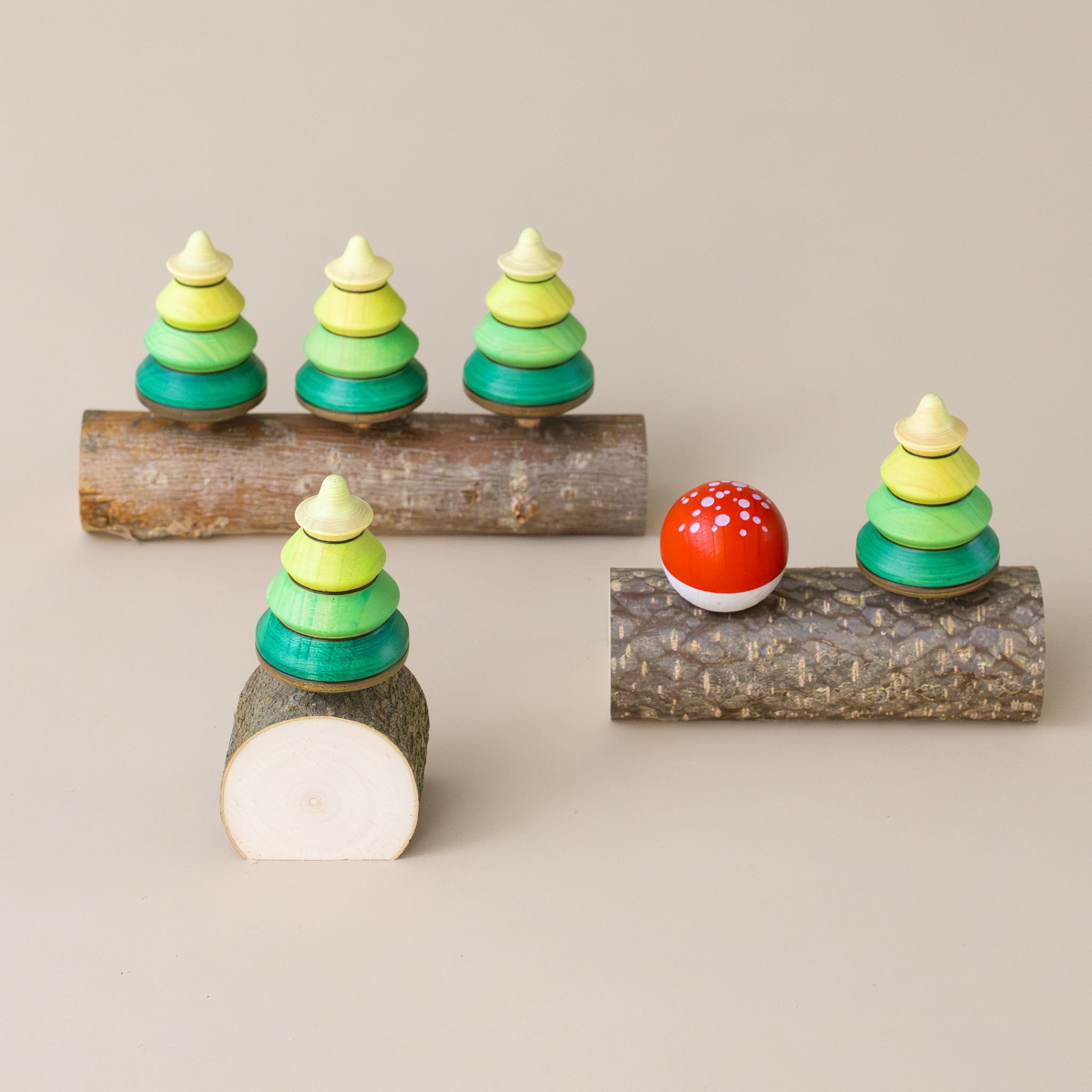 tree-wooden-spinning-top-green-ombre-coloring-and-wooden-base-collection-in-a-grove