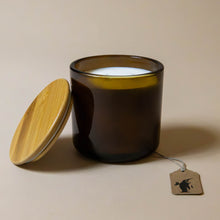 Load image into Gallery viewer, green-glass-candle-shown-with-wood-cover
