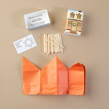 Load image into Gallery viewer, components-showing-riddle-matchstick-puzzle-and-orange-paper-hat-housed-within-beige-holiday-home-matchsitck-box