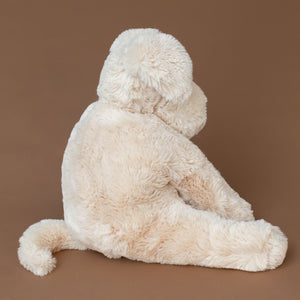 sandy-colored-wanderlust-puppy-stuffed-animal-curled-tail
