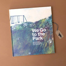 Load image into Gallery viewer, we-go-to-the-park-book-with-illustration-of-swing-set-in-a-field-on-cover