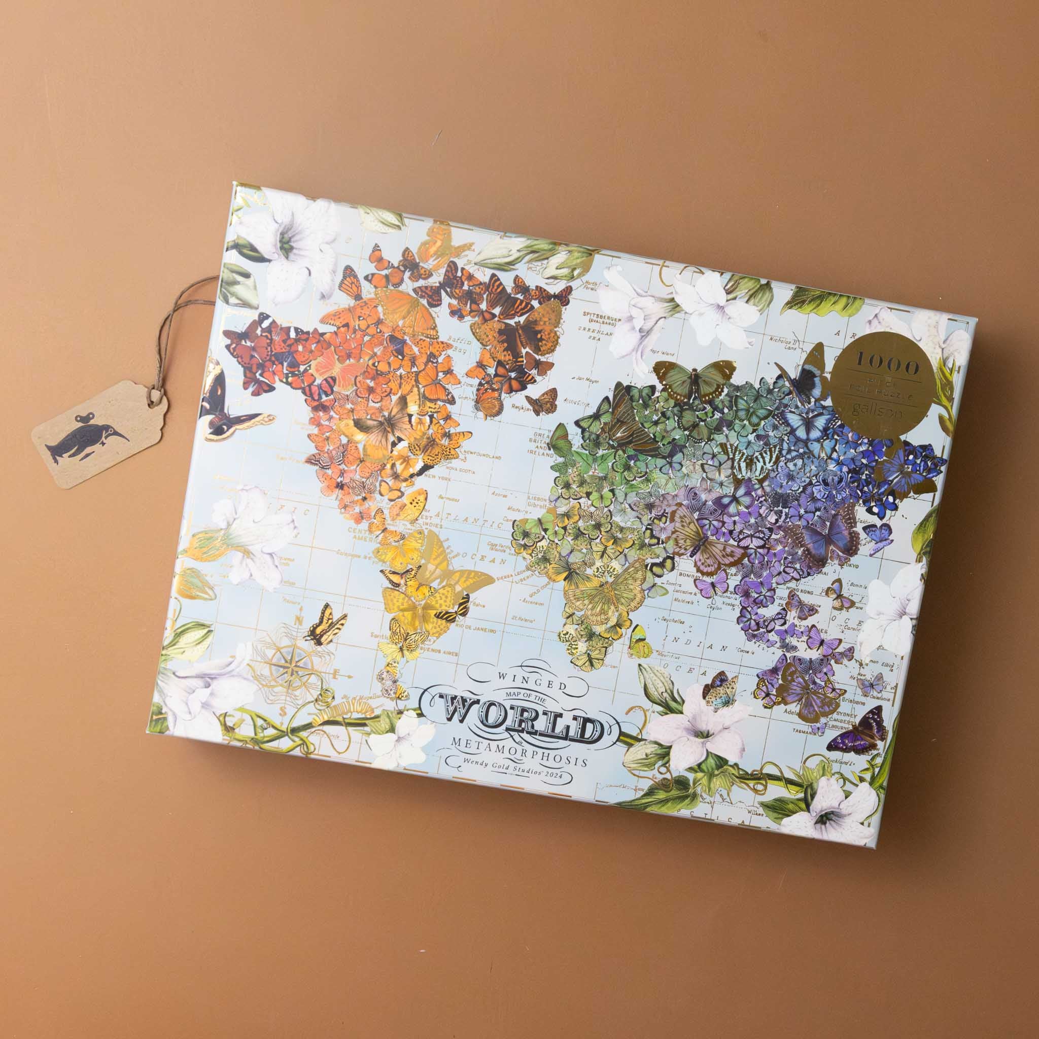 wendy-gold-winged-metamorphosis-1000-piece-gold-foil-puzzle-of-butterfiles-on-a-map-of-the-world
