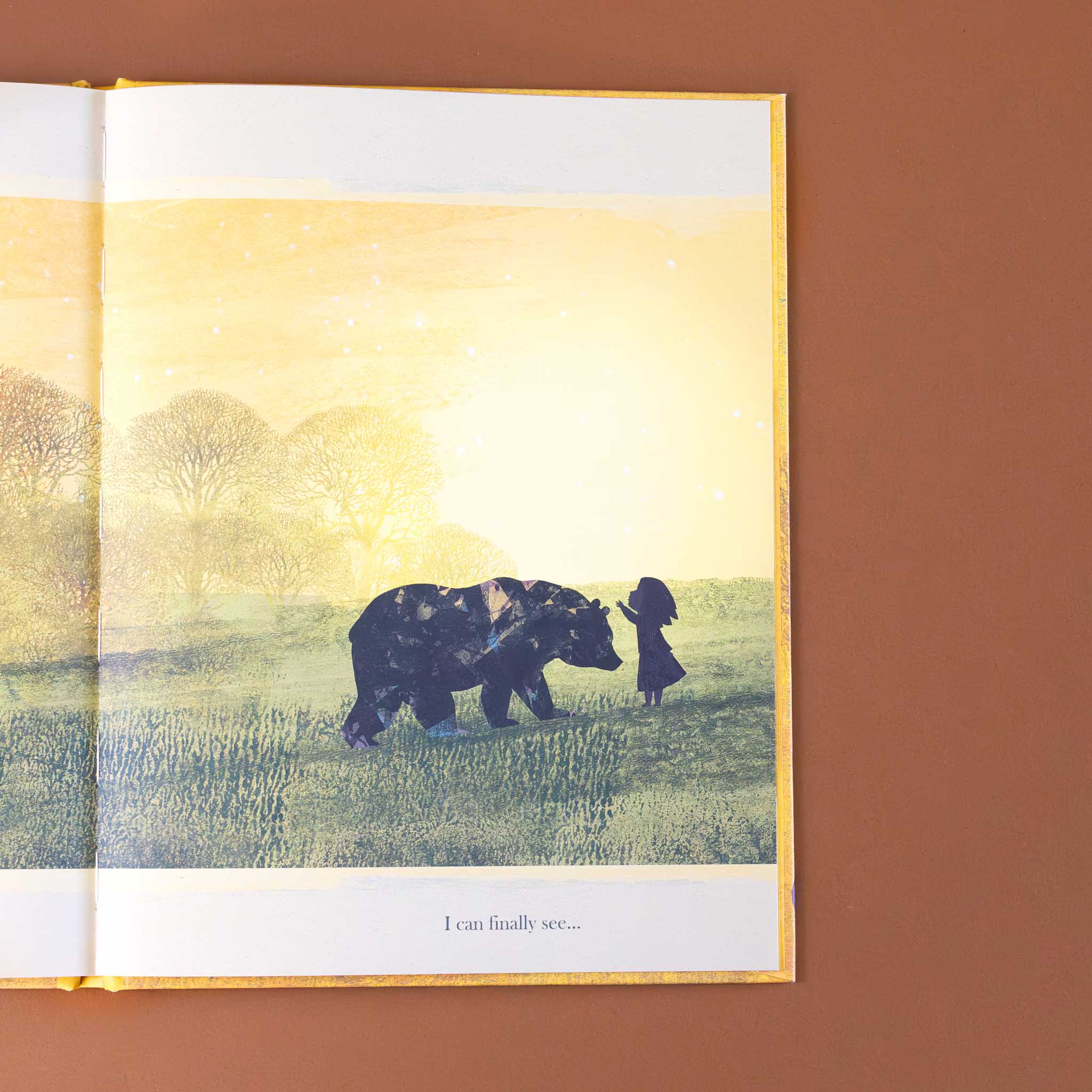 when-i-feel-brave-book-interior-page-with-a-little-girl-becoming-friends-with-a-bear-in-the-field