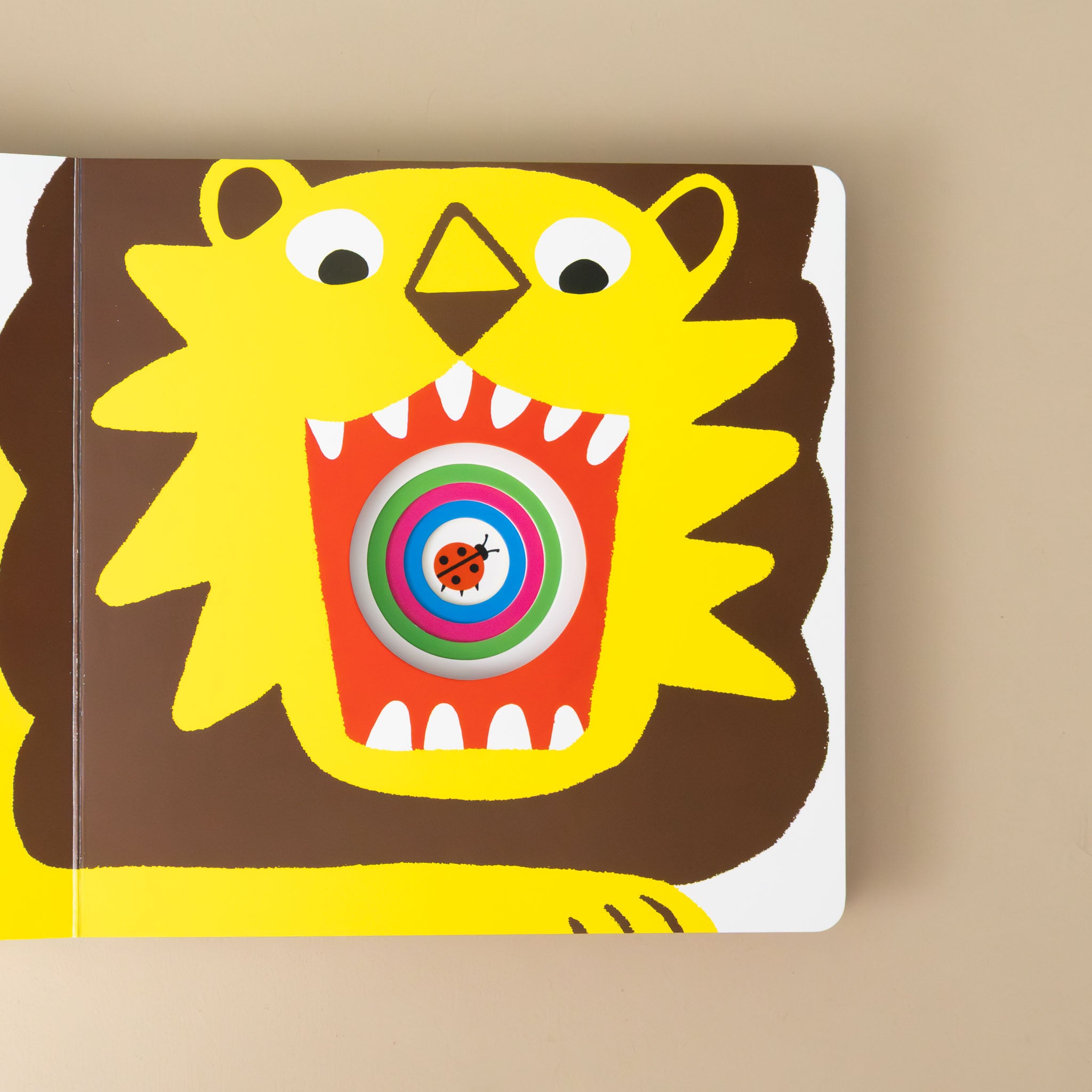 who-ate-the-little-bug-board-book-illustration-with-lions-mouth-open-and-die-cut-circles-in-the-middle-with-lady-bug