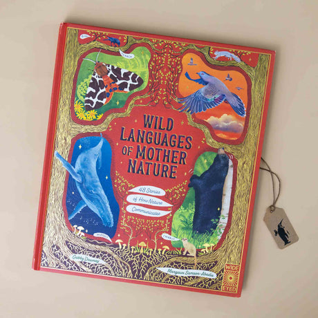 wild-languages-of-mother-nature-cover-with-whale-black-bear-bird-and-moth-on-red-cover-with-gold-foil
