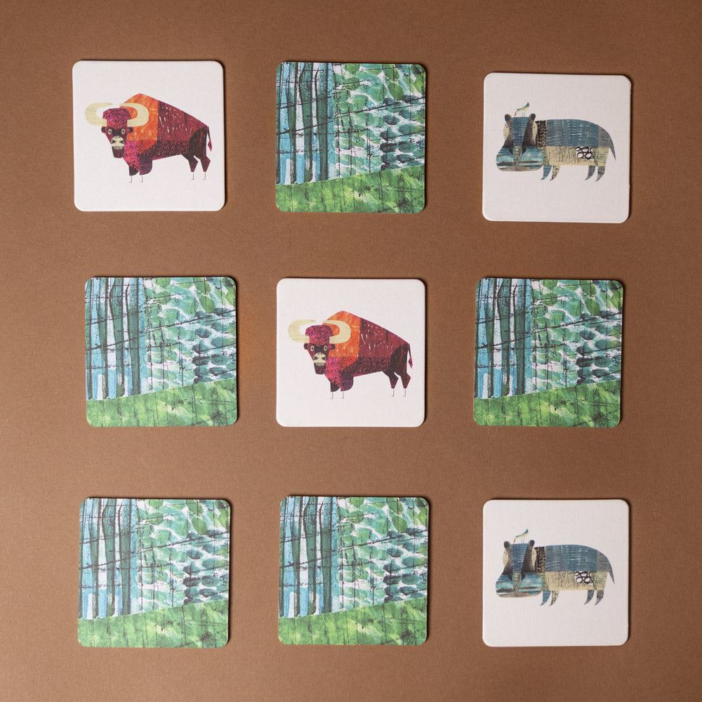 wildlife-collage-memory-game Set of cards with animal illustrations on a brown background