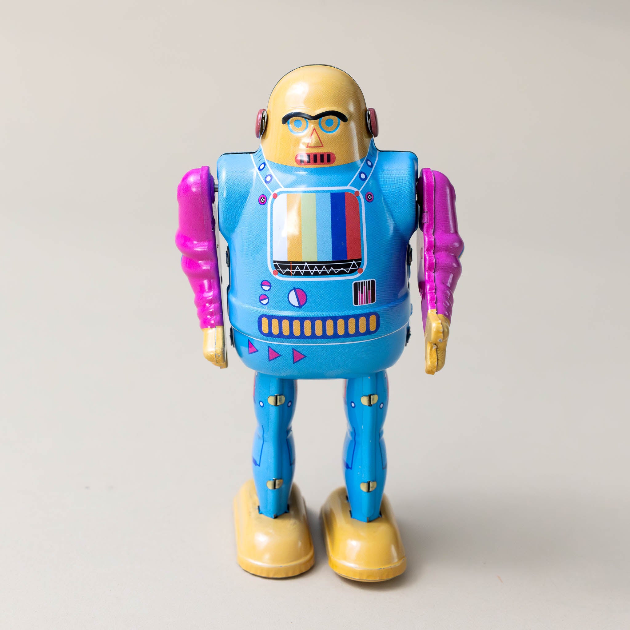 wind-up-tin-telebot-with-blue-body-and-magenta-arms-and-colorful-screen-front