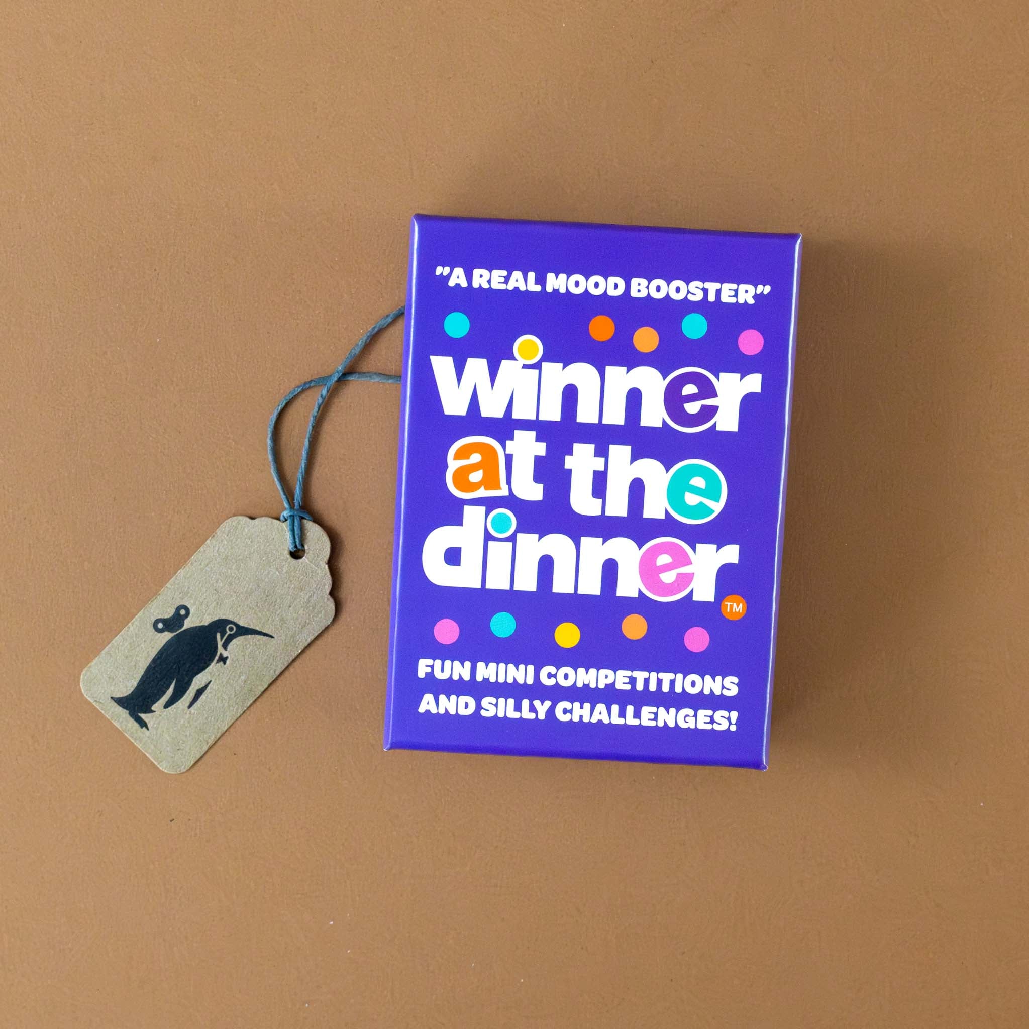 winner-at-the-dinner-game-purple-box-with-colorful-dots