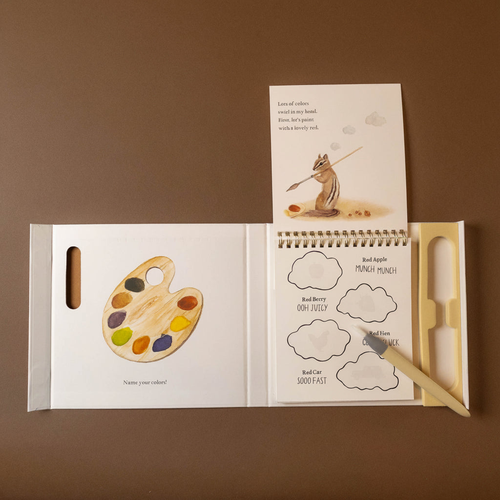 Open wishy-washy-water-reveal-a-board-book-of-first-words--colors with illustrations of a paint palette and a squirrel, on a brown background.