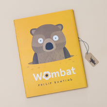 Load image into Gallery viewer, wombat-book-yellow-cover-with-brown-wombat-rising-from-a-hole