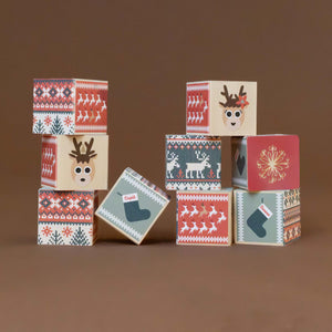 blocks-stacked-showing-various-holiday-patterns-with-reindeer-stockings-snowflakes-and-christmas-trees