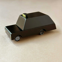 Load image into Gallery viewer, side view of the Black London taxi Candycar