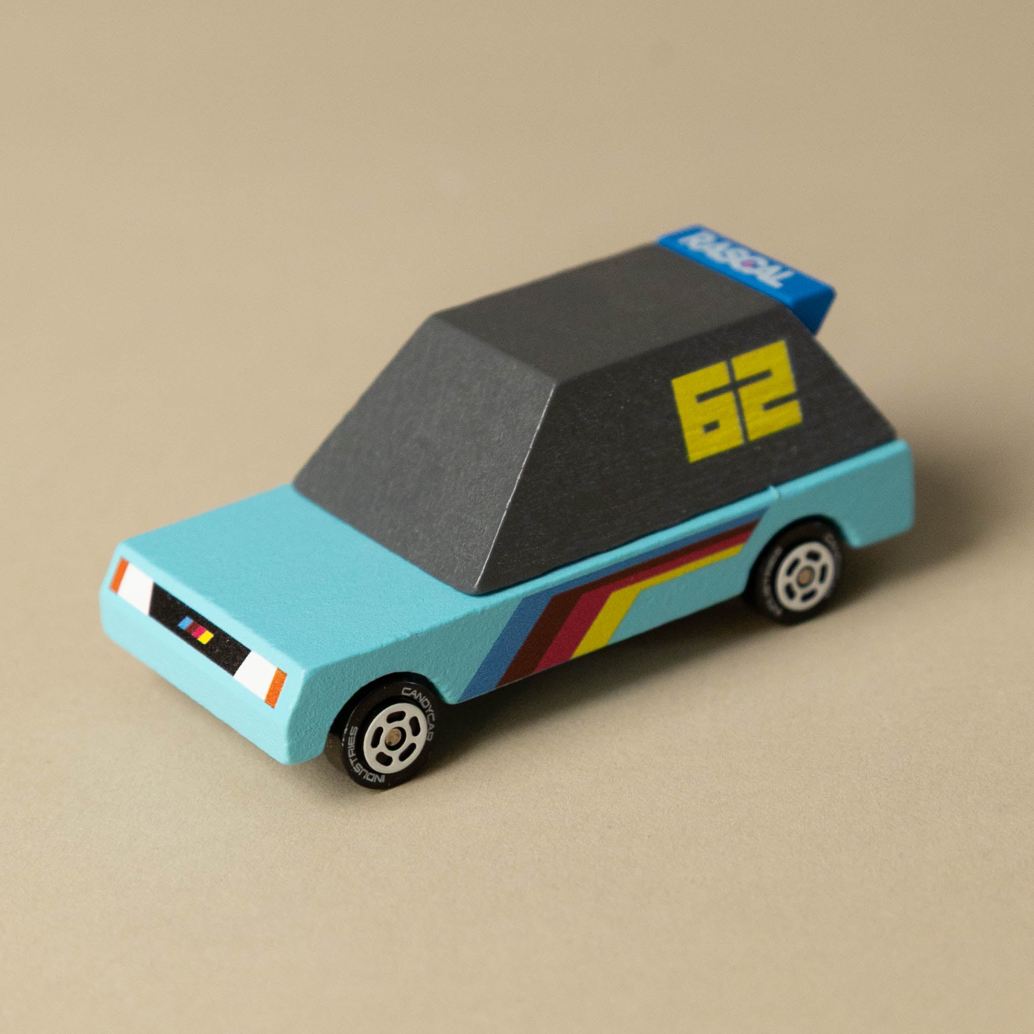 wooden-candycar-toon-4-pack-tokyo-heat Toy blue car model on a beige background