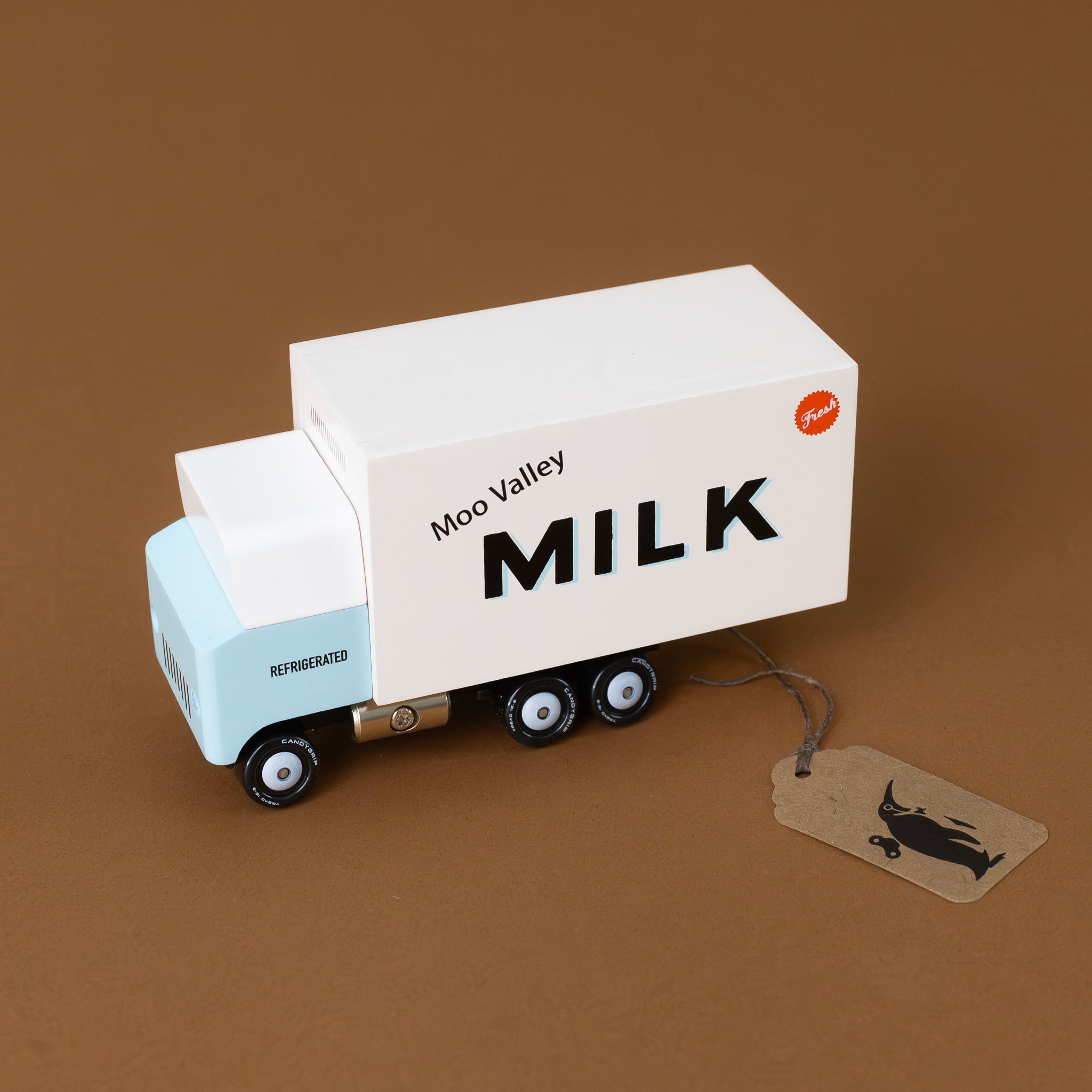 baby-blue-and-white-wooden-candyvan-milk-delivery-truck-with-Moo-Valley-Milk-on-the-side-with-a-red-fresh-emblem