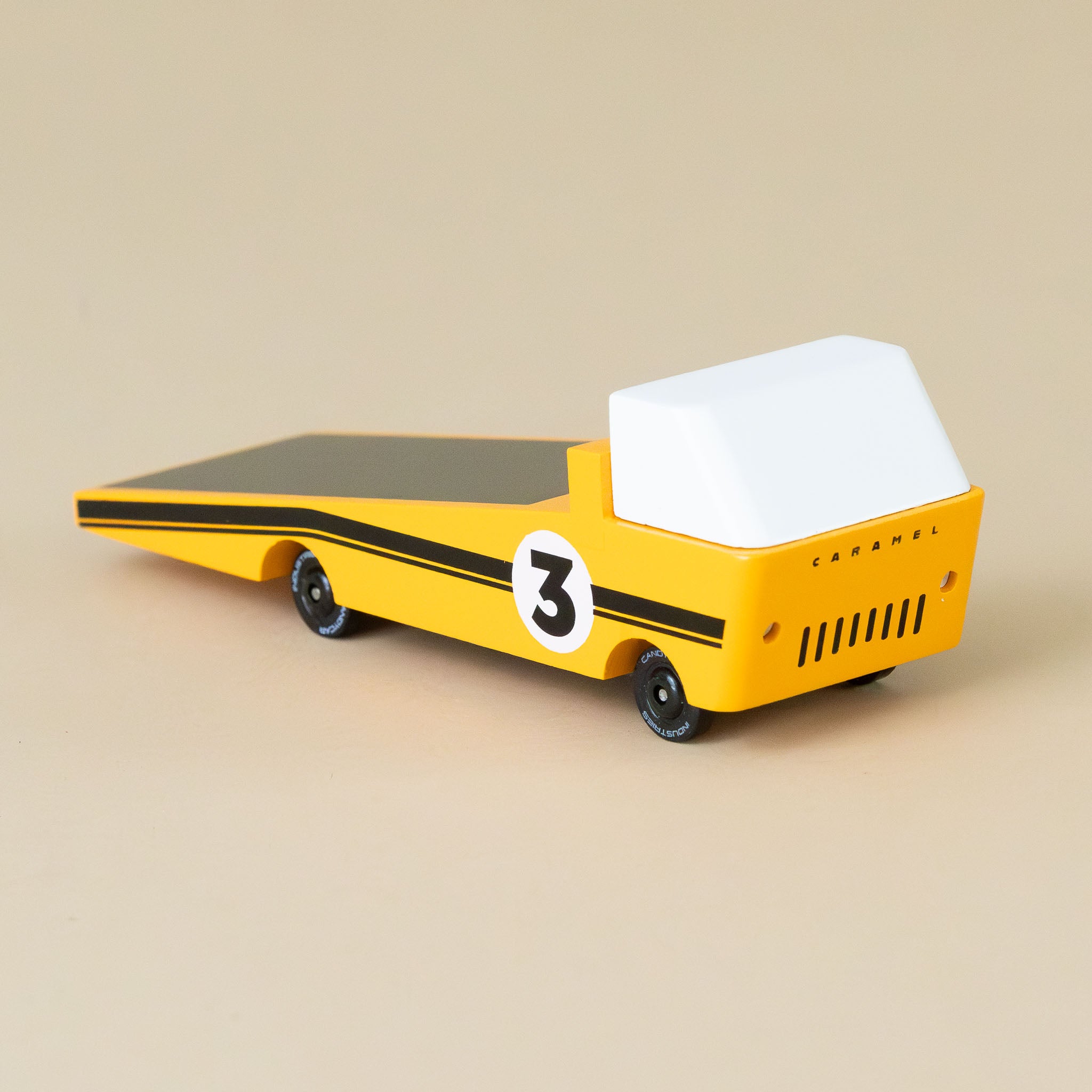 yellow-wooden-candyvan-racer-tow-truck-with-white-cab-black-stripes-and-number-3-emblem