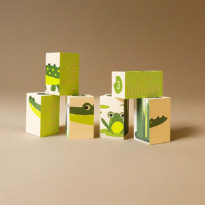 stacked-blocks-with-ruler-frog-swamp-grasses-and-alligator